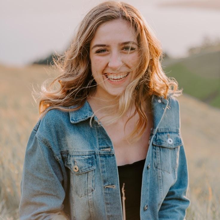 Kaveri Mehta, Lead Design Curator at FlintQuaySierra, reviewing corporate floral arrangements
